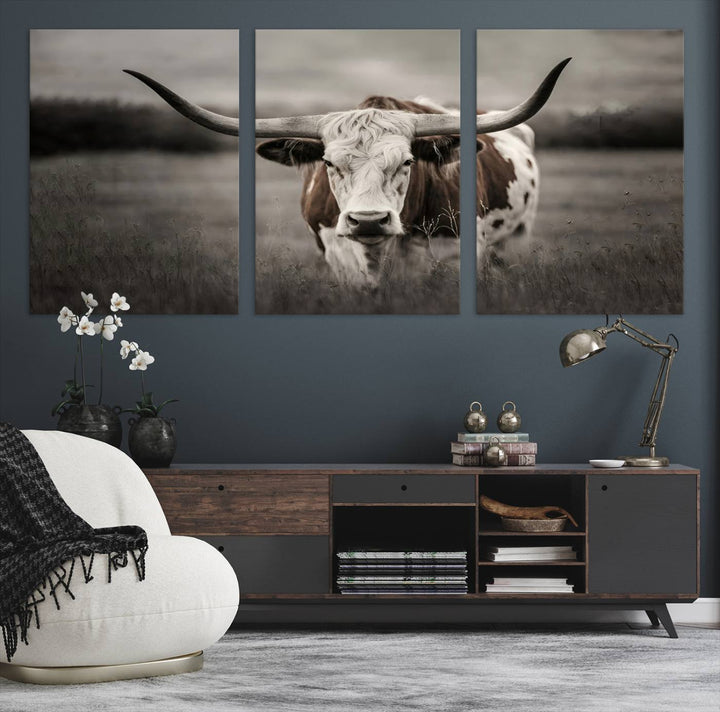 The Texas Longhorn Cow Canvas Wall Art Print adds a rustic touch to a living room.