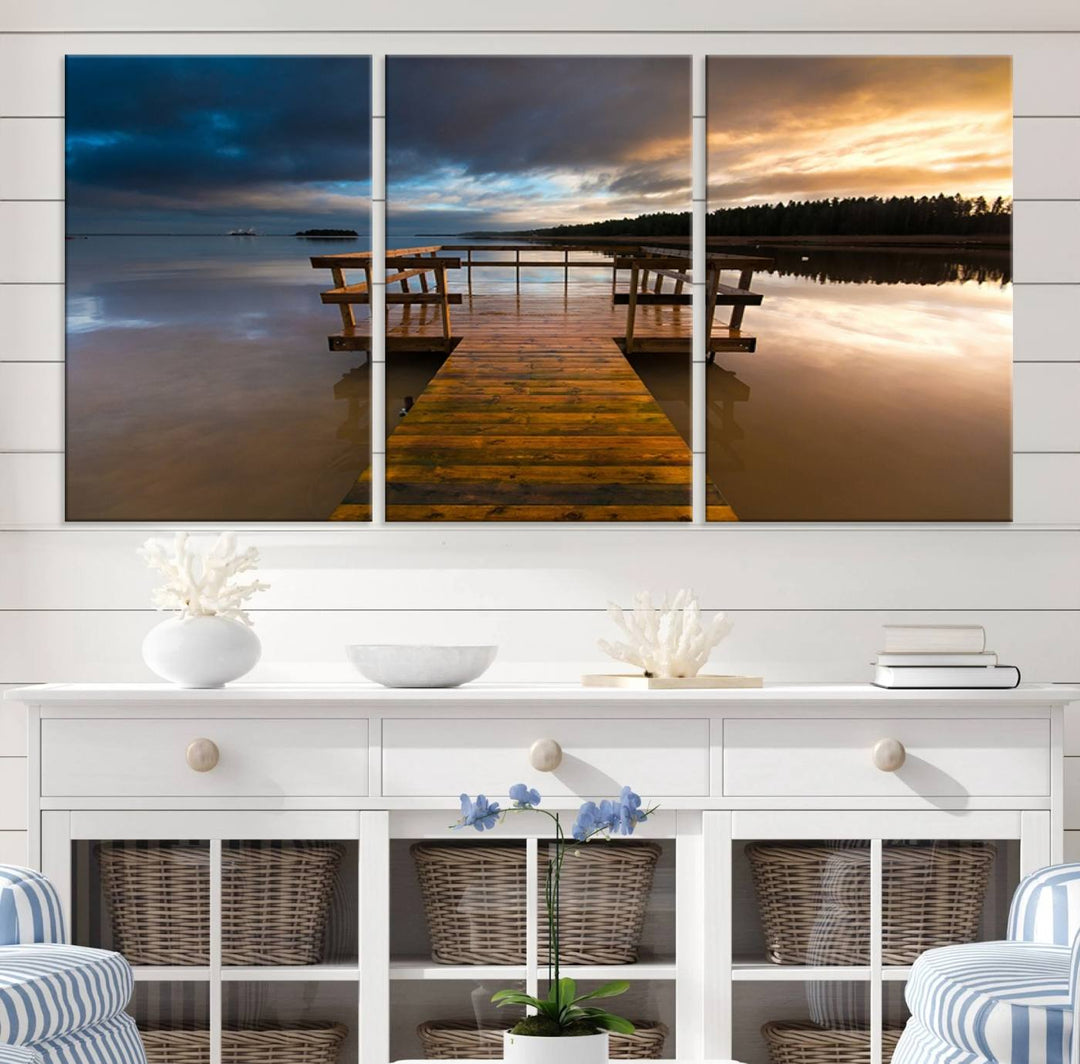 The "Serene Lake Pier at Sunset" landscape canvas print, crafted as ready-to-hang and framed wall art, enriches the contemporary setting by capturing the tranquility of a lakeside pier at sunset.