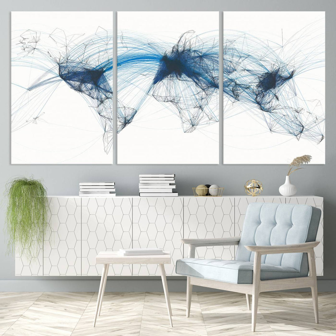 The Aviation Flight Map Wall Art is a set of three abstract panels featuring a world map with blue lines, resembling a flight map. Ideal for aviation enthusiasts, this ready-to-hang framed air traffic art print enhances the appeal of modern decor.