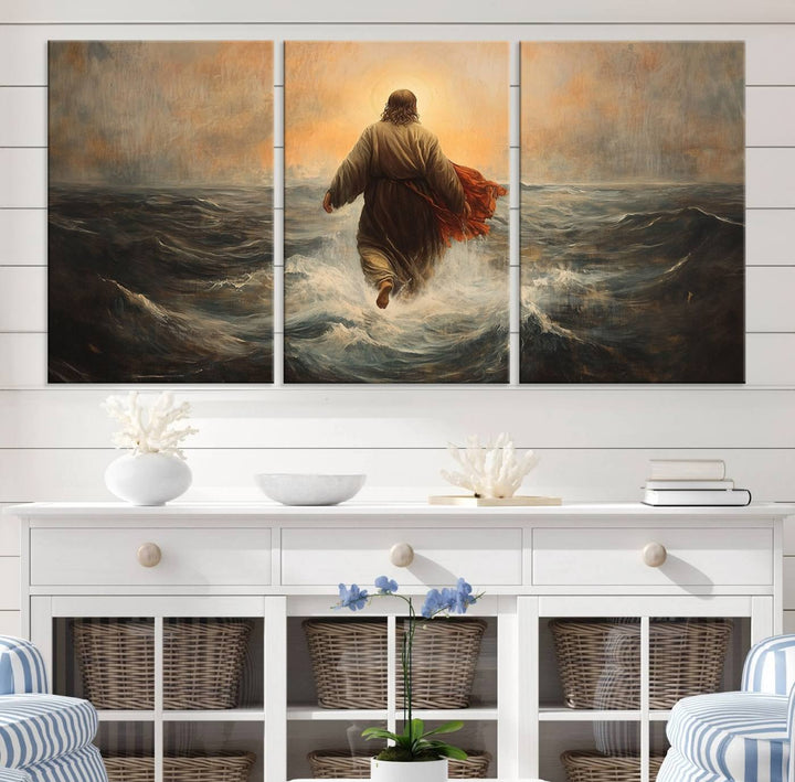 A modern living room is adorned with a triptych titled "Jesus Walking on Water, Christian Wall Art, Jesus Christ Walking on Oil Painting Style Print." The artwork, presented on museum-quality canvas, showcases vibrant colors and exquisite detail.