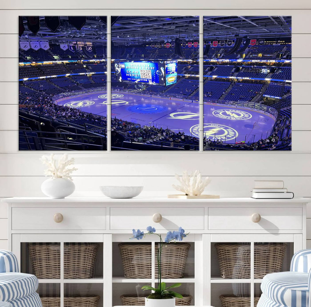 The wall art canvas print at Amalie Arena features team logos on ice, encapsulating the vibrant atmosphere of an NHL hockey stadium.