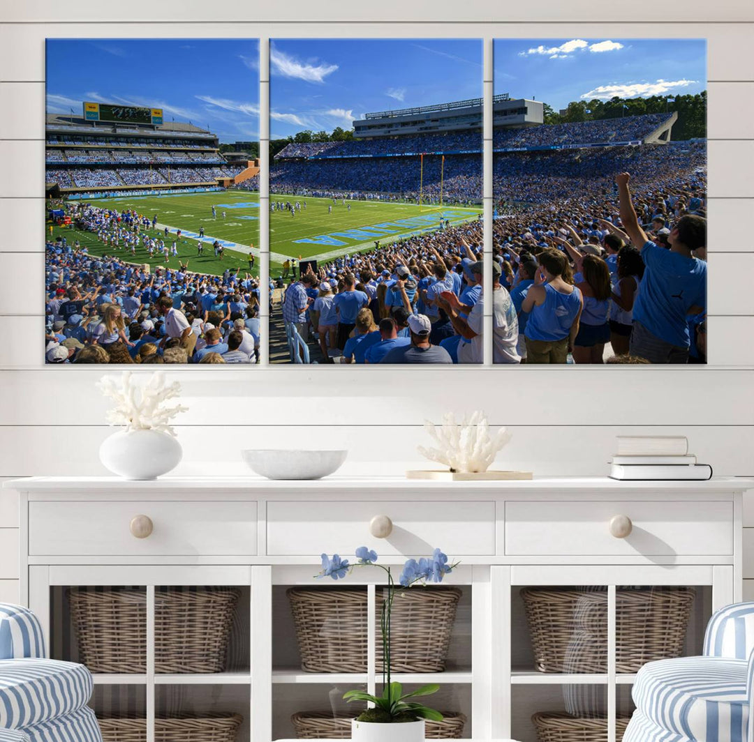 A gallery-quality canvas wall art print featuring the University of North Carolina Tar Heels Football Team and Chapel Hill's Kenan Memorial Stadium adorns the cafe wall.