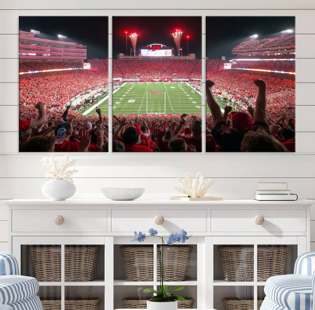 The University of Nebraska Cornhuskers Football Team Print, a vibrant three-panel canvas depicting Lincoln Memorial Stadium filled with enthusiastic fans from the end zone perspective, features a gallery-quality finish.