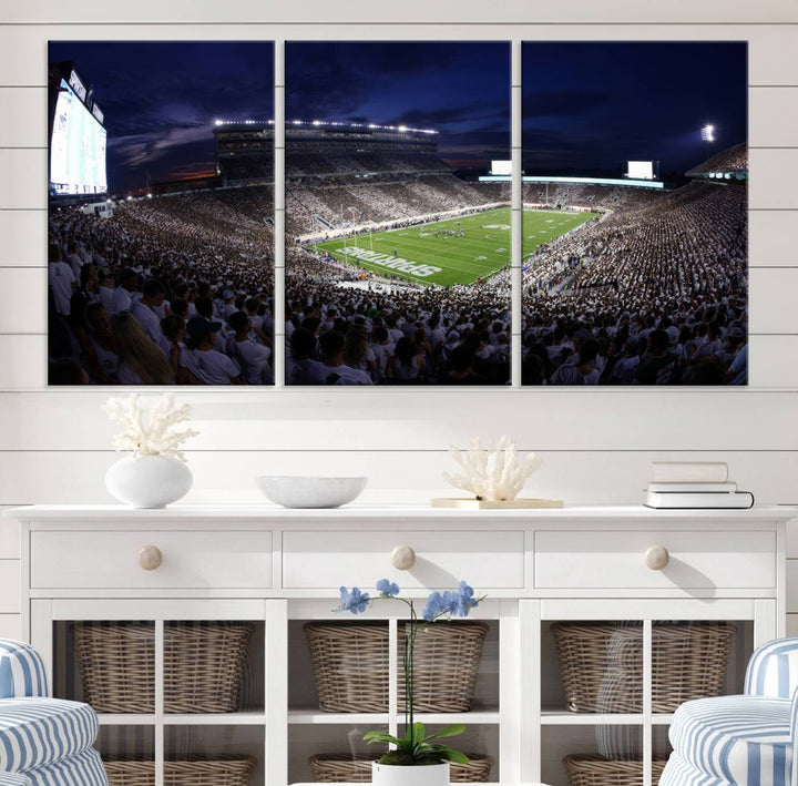 A packed football stadium at night, with bright lights and fans in white, depicted in a Michigan State Spartans Stadium wall art.