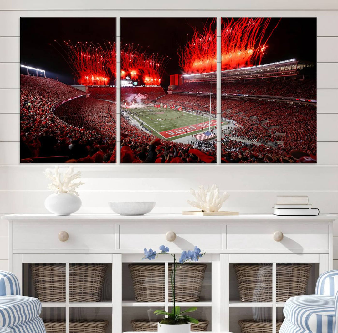 A vibrant red canvas art of a packed Ohio State Buckeyes stadium at night with fireworks.