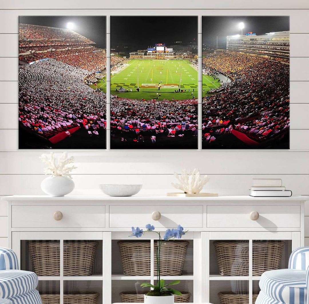 The Maryland Terrapins Football Wall Art Canvas showcases a packed SECU Stadium at night with a bright field and cheering fans.