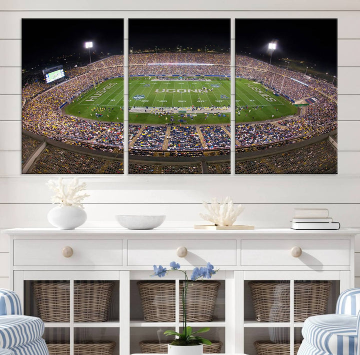 A large football stadium at night, featuring the UCONN Huskies, is depicted on the East Hartford Pratt & Whitney Stadium Wall Art Canvas Print.