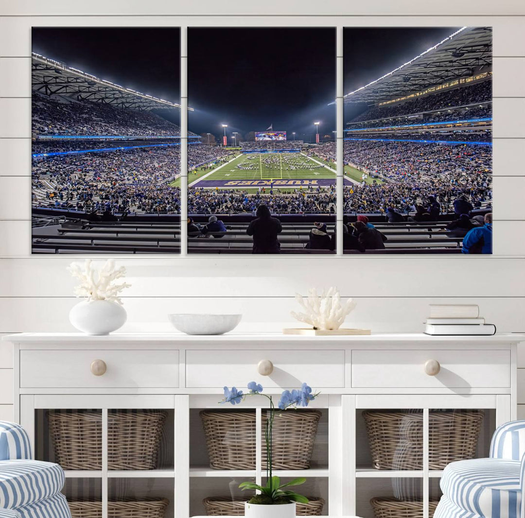 A canvas print titled The University of Washington Huskies Football depicts a packed Husky Stadium at night, as seen from the stands.