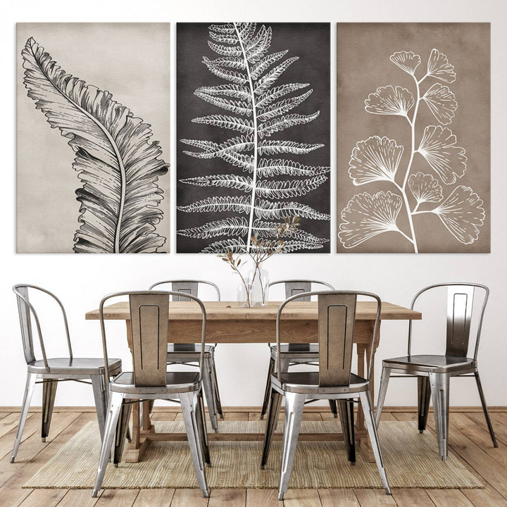 Three framed botanical wall art pieces are displayed in a bright room.