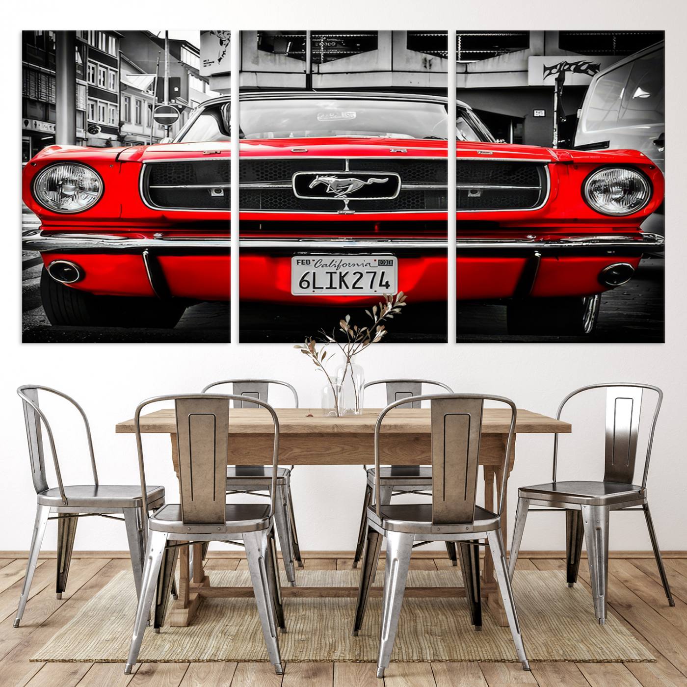 Front view of a bold red 1960s Ford Mustang parked in an urban environment, captured in dramatic contrast with a black-and-white city backdrop, emphasizing its timeless American muscle car identity.