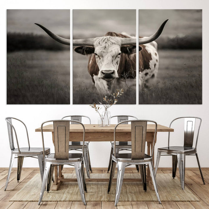 The Texas Longhorn Cow Canvas Wall Art Print adds a rustic touch to a living room.