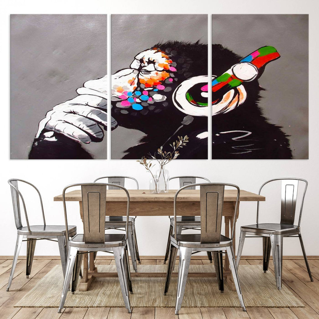 A vibrant triptych, the "DJ Monkey Listening to Music" wall art print, features a Banksy-inspired large canvas adorned with colorful modern pop art. This striking piece elegantly enhances the room with its dynamic and lively depiction.