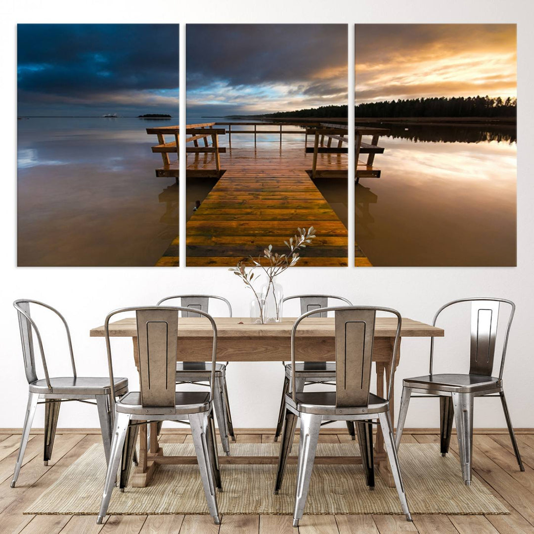 The "Serene Lake Pier at Sunset" landscape canvas print, crafted as ready-to-hang and framed wall art, enriches the contemporary setting by capturing the tranquility of a lakeside pier at sunset.