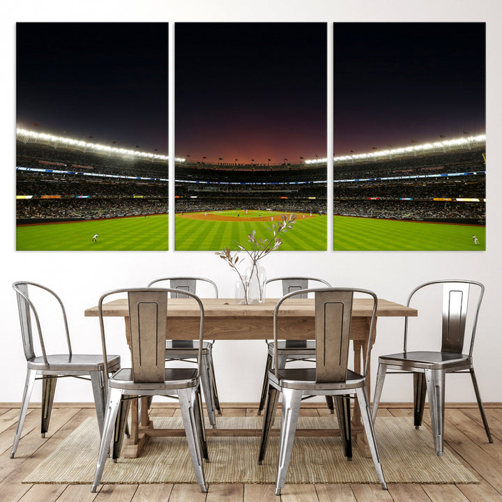 A night game at Yankee Stadium depicted on canvas beneath a sunset sky.