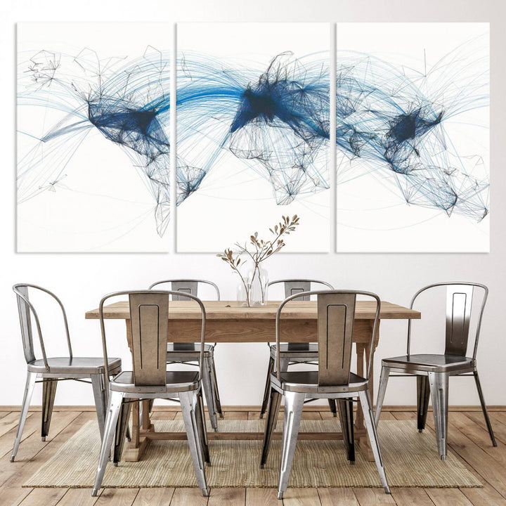 The Aviation Flight Map Wall Art is a set of three abstract panels featuring a world map with blue lines, resembling a flight map. Ideal for aviation enthusiasts, this ready-to-hang framed air traffic art print enhances the appeal of modern decor.