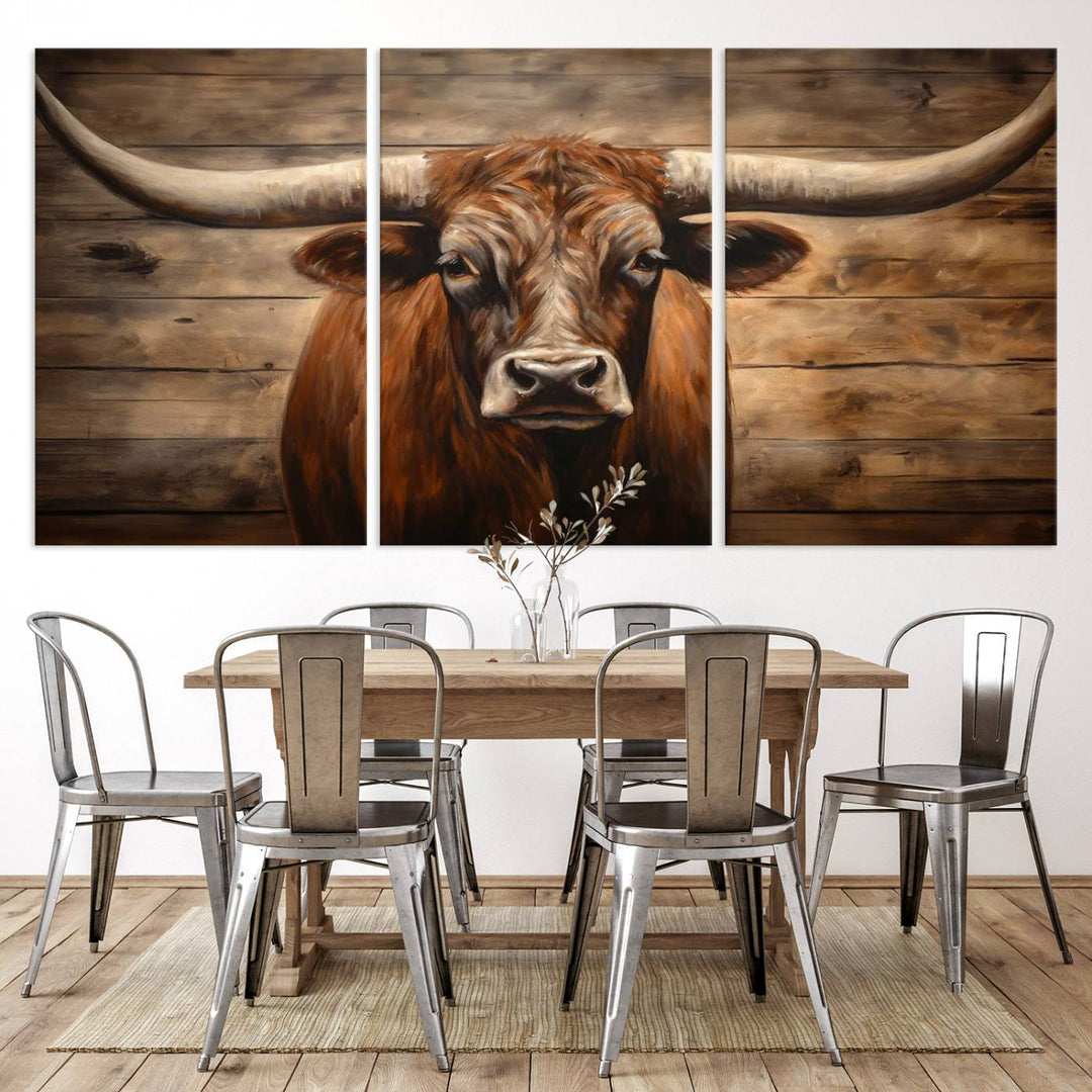 The Longhorn Bull Wall Art, a ready-to-hang canvas print, showcases an image of a brown longhorn cow set against a wooden background, perfect for those looking to enhance their space with rustic farmhouse and western barn decor.