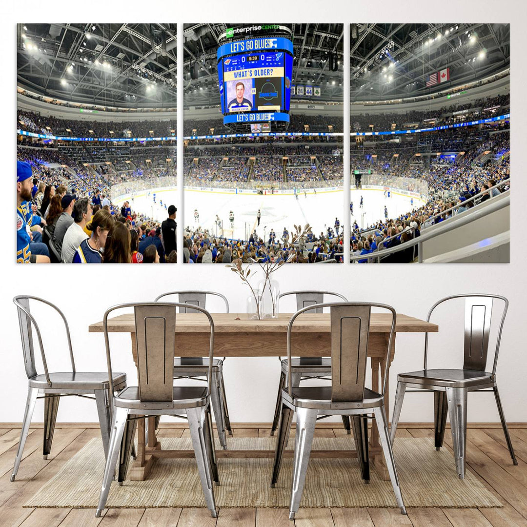 Wall art prints depicting the bustling scenes of the St. Louis Blues being cheered on by a full house at the Enterprise Center, beneath a large scoreboard.