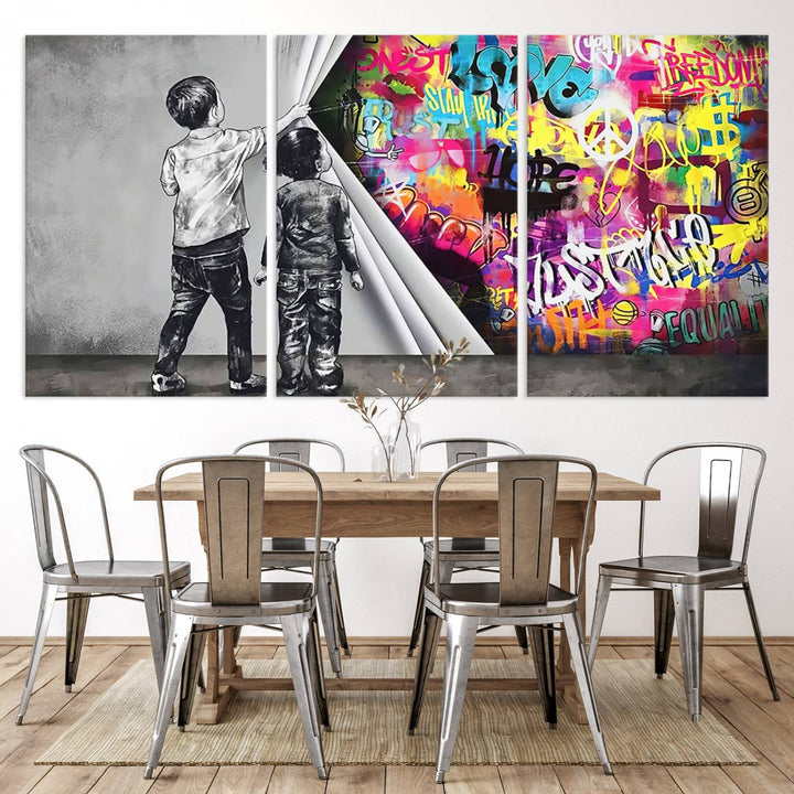 The Banksy Print - Street Art Canvas features a vibrant and bold image of two children lifting a curtain to reveal colorful graffiti. It's ready to hang, adding an urban modern decor vibe.