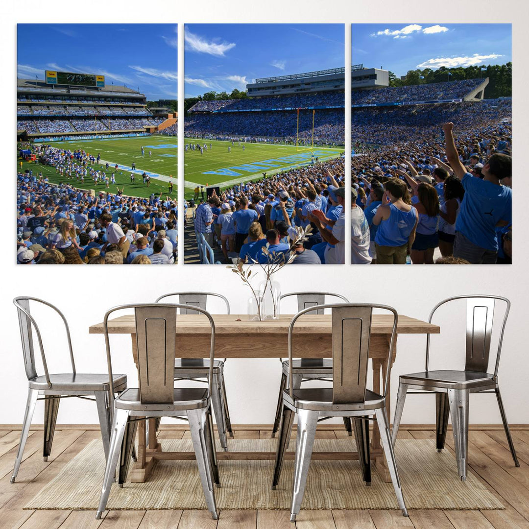 A gallery-quality canvas wall art print featuring the University of North Carolina Tar Heels Football Team and Chapel Hill's Kenan Memorial Stadium adorns the cafe wall.