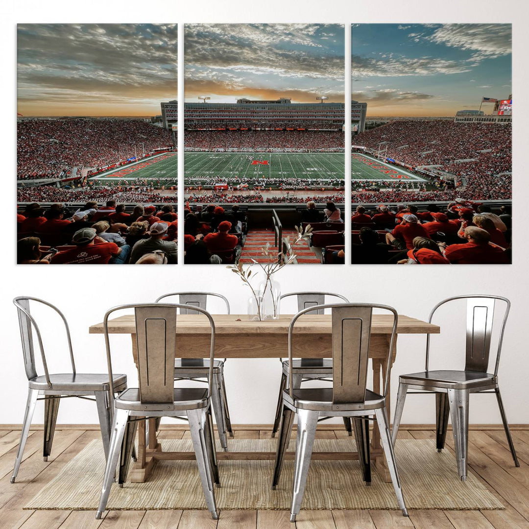 The living room features a stunning triptych of Lincoln Memorial Stadium wall art canvas print, celebrating the University of Nebraska Cornhuskers football team. This piece serves as captivating wall art, showcasing a gallery-quality finish.