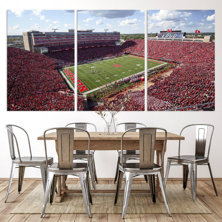 The University of Nebraska Cornhuskers Football Team Print showcases a vibrant triptych of Lincoln Memorial Stadium, depicting a packed football stadium filled with energetic fans. This handmade art piece is crafted in the USA and printed on premium canvas for a gallery-quality finish.