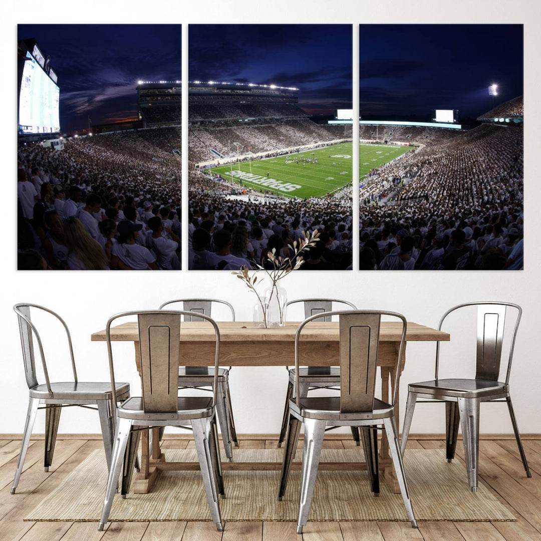 A packed football stadium at night, with bright lights and fans in white, depicted in a Michigan State Spartans Stadium wall art.