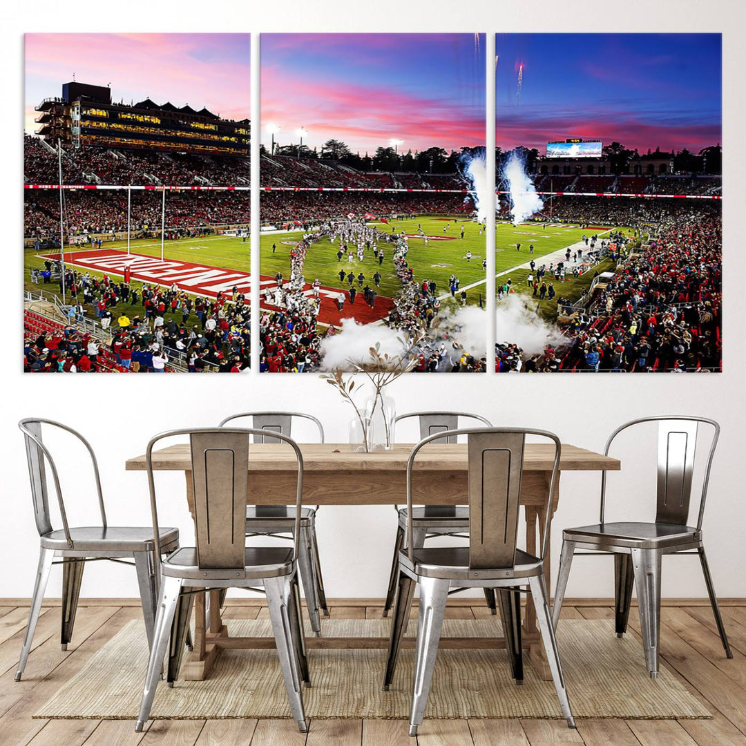 The wall art features a canvas print of the Stanford Cardinal football team, capturing players, fireworks, and smoke against the backdrop of a sunset at Stanford Stadium.