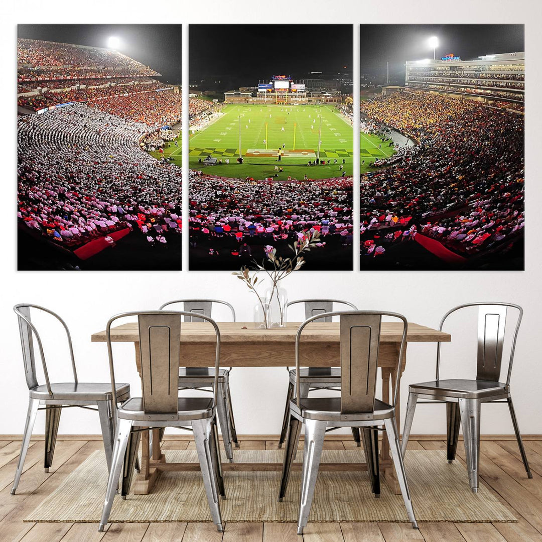 The Maryland Terrapins Football Wall Art Canvas showcases a packed SECU Stadium at night with a bright field and cheering fans.