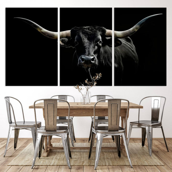 The Texas Black Longhorn Bull Canvas Print, featuring large curved horns set against a dark background, is ideal for Western decor.