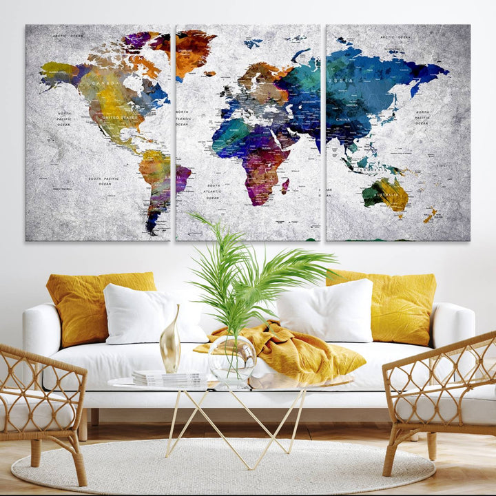 The World Map Art Canvas Print, featuring country names on a grunge-stained gray background, is perfect for stylish home decor.