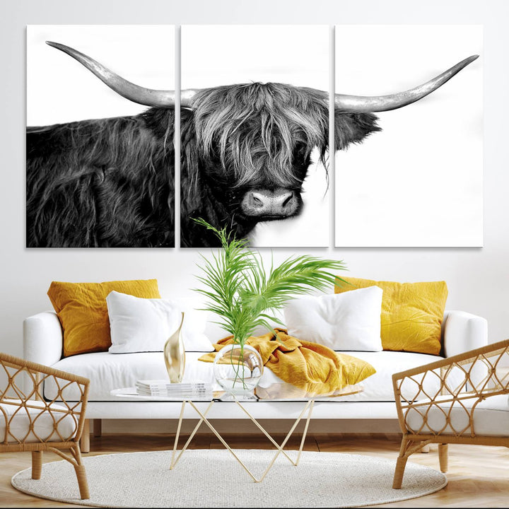 The Black and White Highland Cow Multi Panel Wall Art Canvas Print with UV-protection hangs prominently.