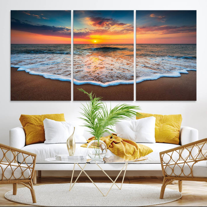 A Sunset with Calm Waves on the Beach Wall Art Canvas Print adorns the dining room.