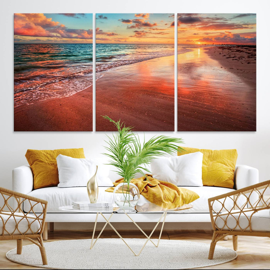 A Vibrant Sunset Beach Canvas Print with ocean waves and sandy shoreline enhances coastal-themed interiors.