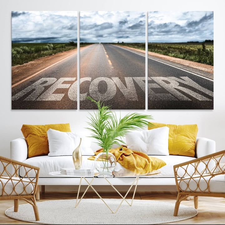 The Recovery Road Wall Art Canvas Print depicts a road under a cloudy horizon.