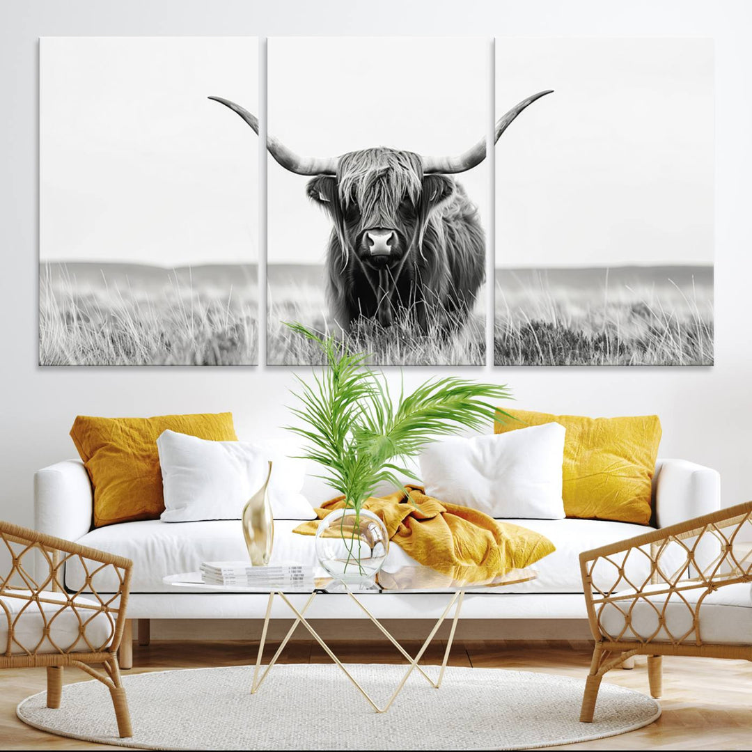 The Majestic Beauty canvas of a Highland cow adds elegance to the white walls as it hangs prominently.