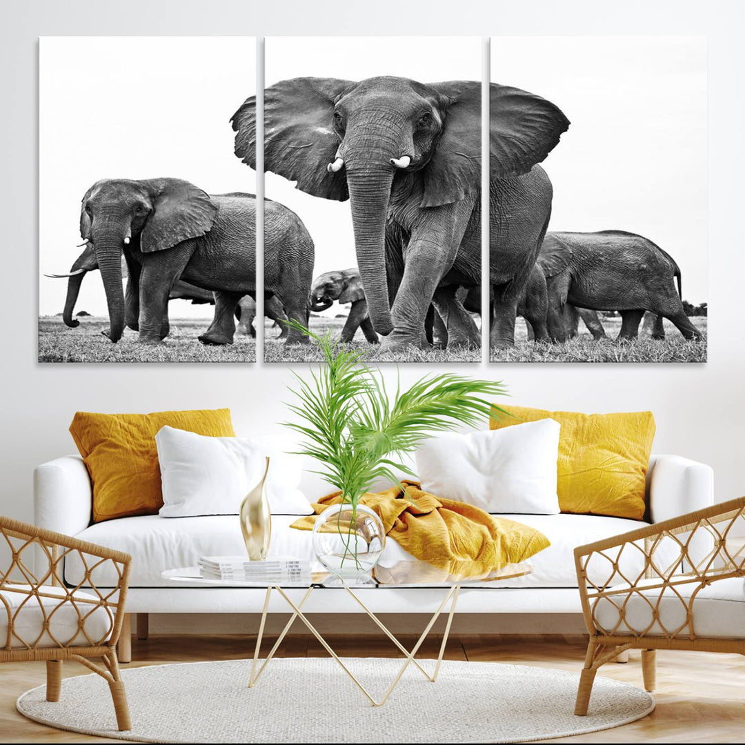 A modern dining area features a Black White Elephant Family Wall Art Canvas Print.