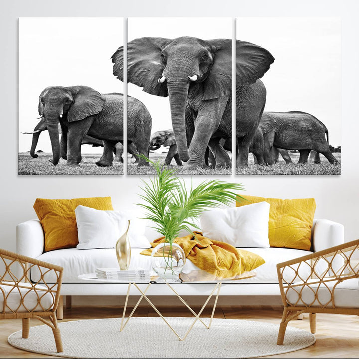 A modern dining area features a Black White Elephant Family Wall Art Canvas Print.