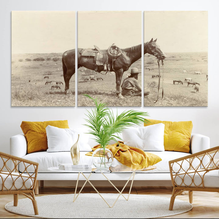 Cowboy Wall Art - Vintage Western Horse Canvas Print features a cowboy kneeling by his horse in a field.