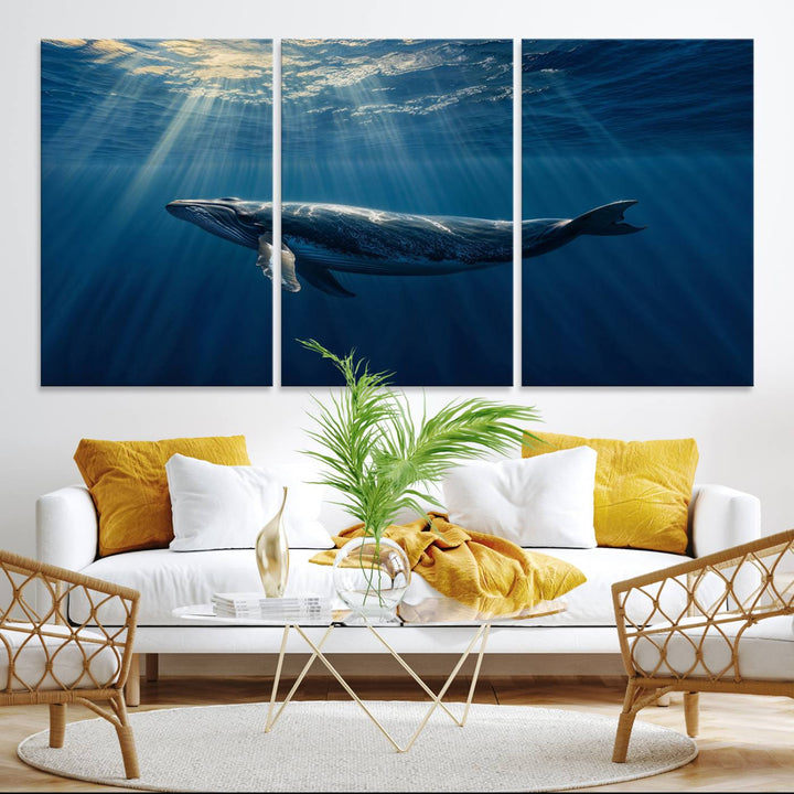 The Whale under Ocean wall art canvas print graces the white wall.