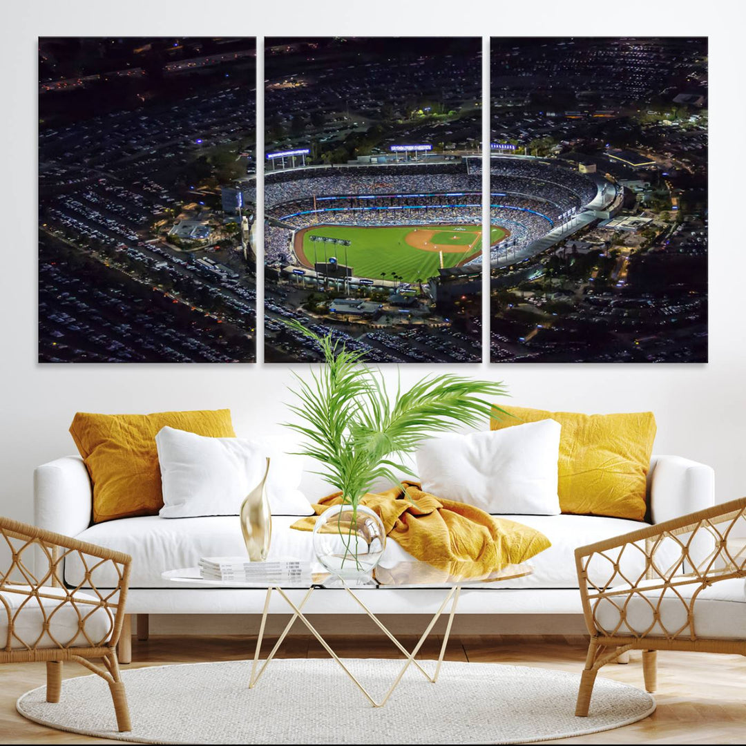 A large Los Angeles Dodgers print of Dodger Stadium at night is displayed near a window.