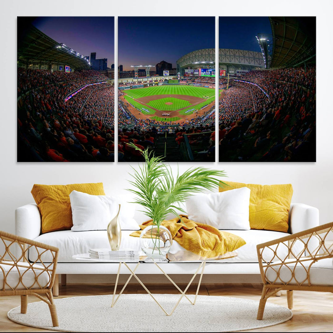 A canvas print of Houston Minute Maid Park at dusk is mounted on the wall.