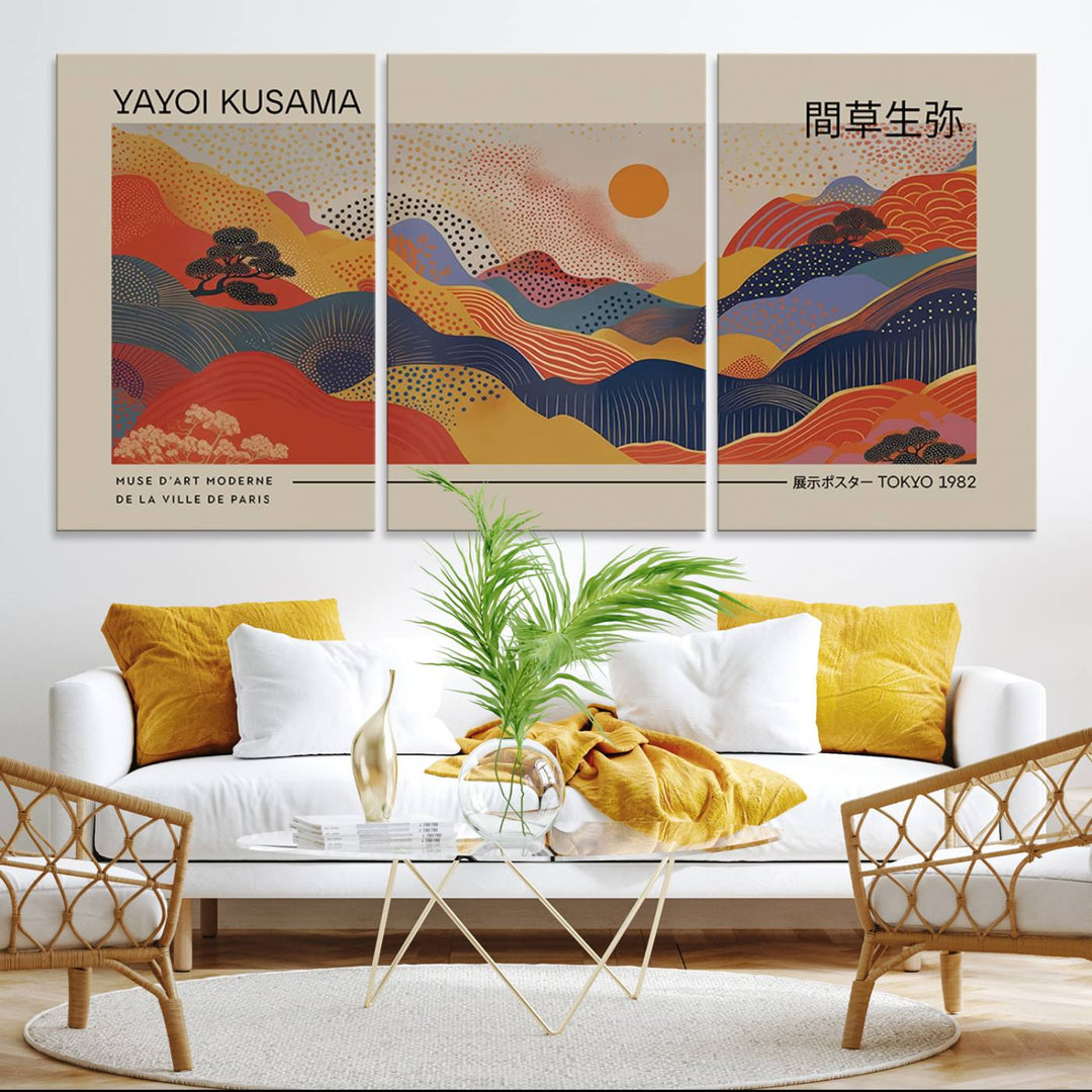 The Yayoi Kusama vibrant landscape canvas print featuring abstract mountains and a sun enhances the space with its modern aesthetic.