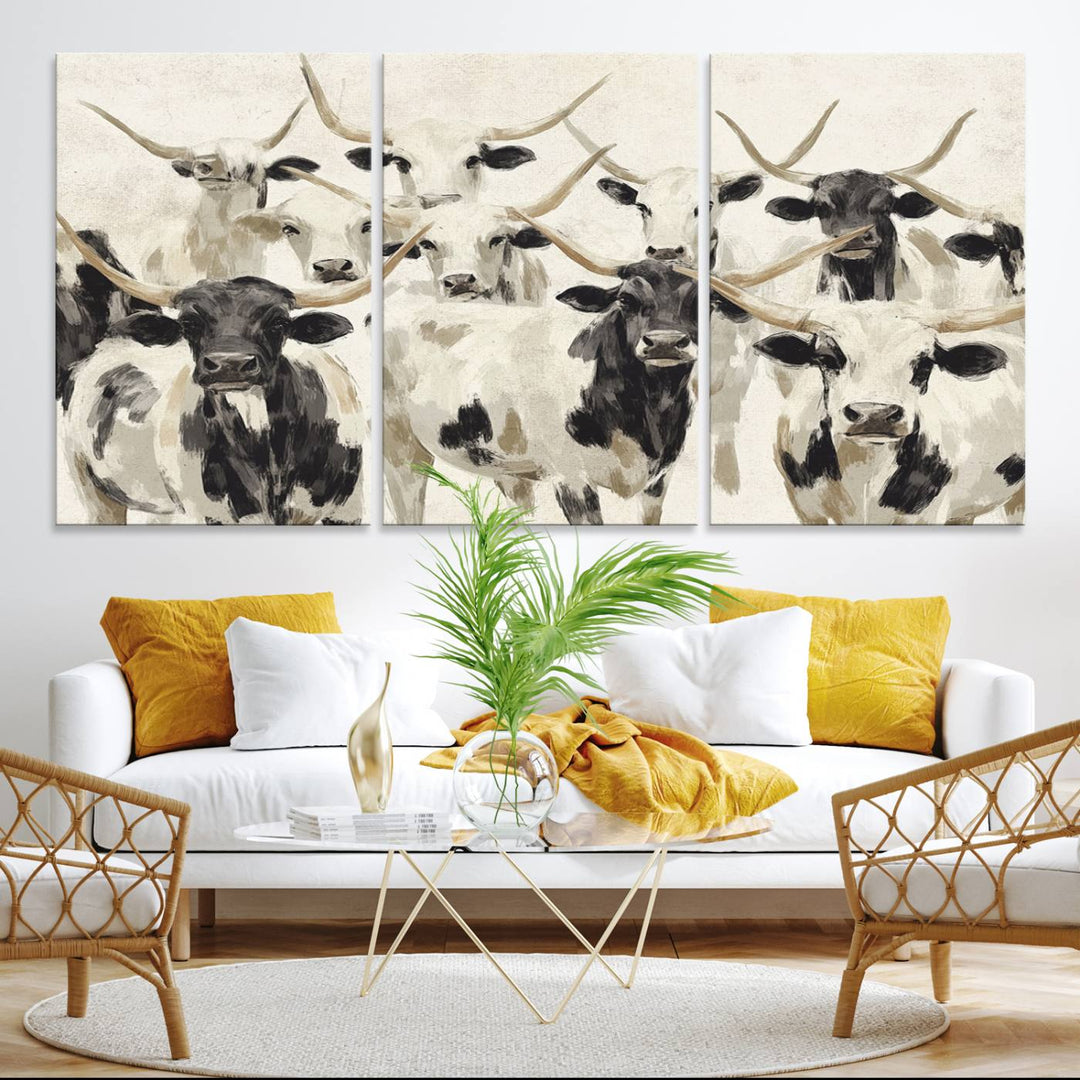 Canvas print titled Longhorn Texas Cow Drawing, depicting longhorn cattle with black and white markings, made in the USA, displayed on the wall.