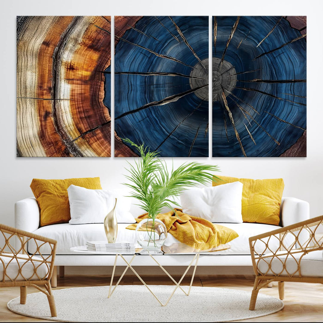 The Abstract Tree Rings Canvas Print features blue, brown, and orange rings that highlight wood grain and natures beauty.