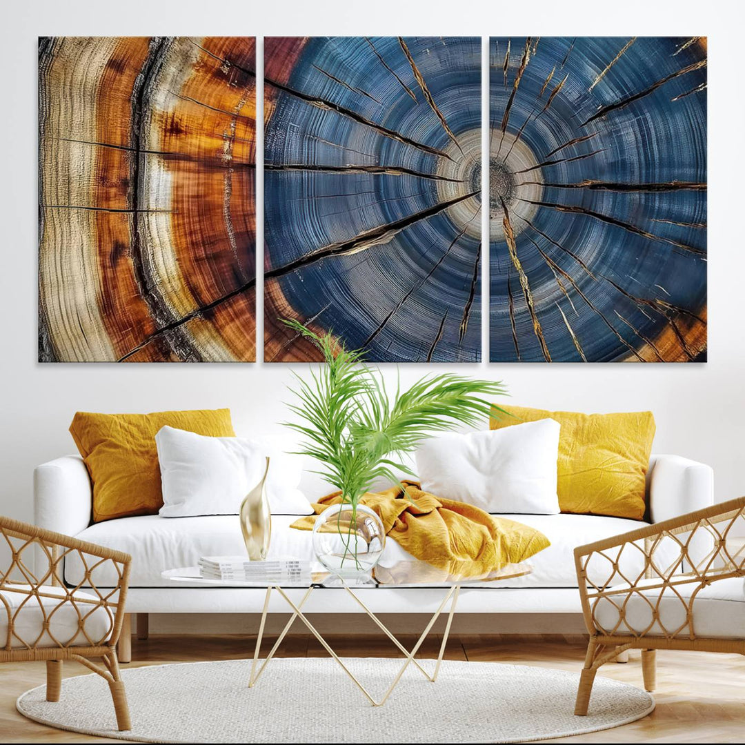 Close-up of blue, brown, and orange wood grain rings on the Abstract Tree Rings Canvas Wall Art Print.