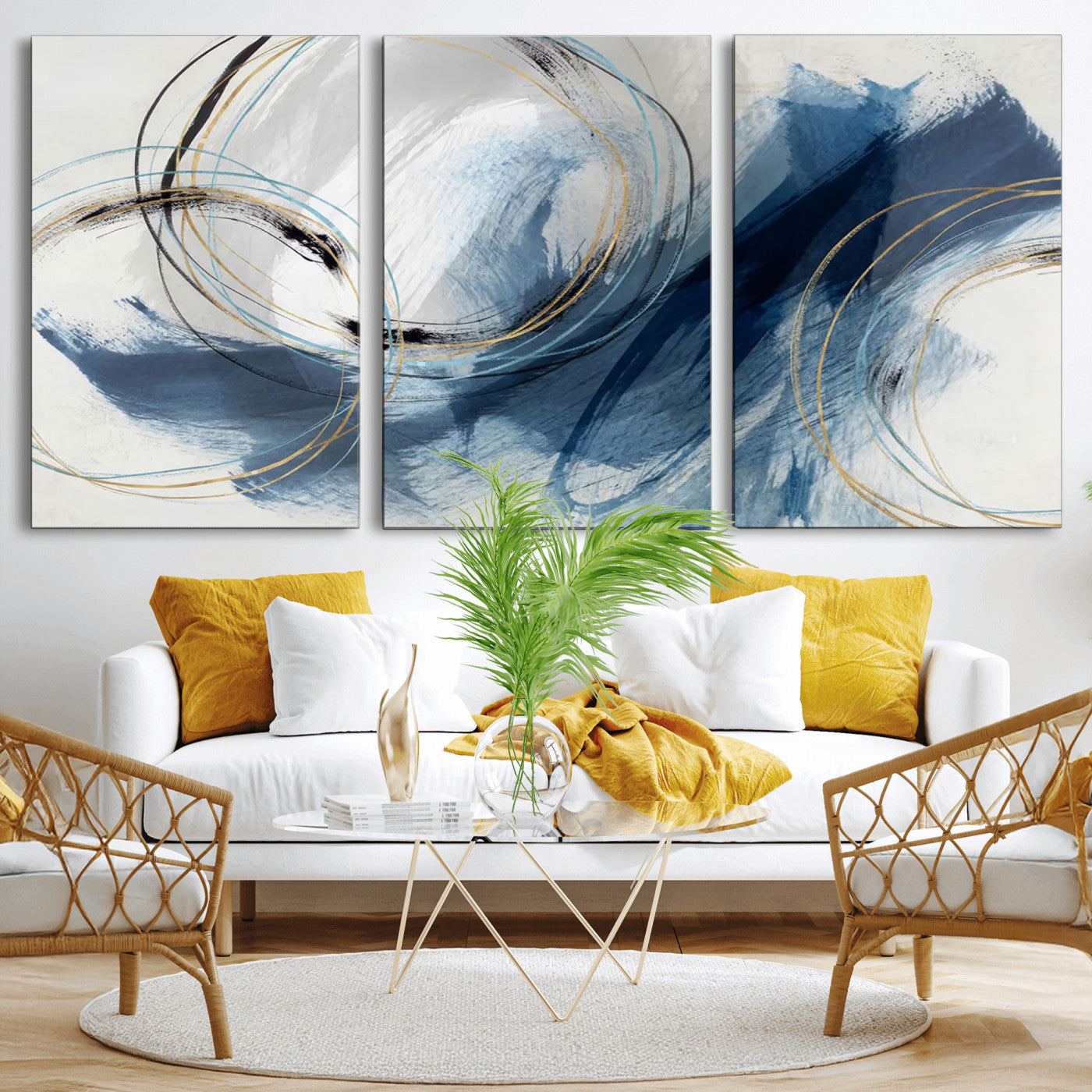 Abstract wall art featuring dynamic brush strokes in shades of blue and gray, overlaid with delicate circular line patterns in gold, black, and light blue on a white background.