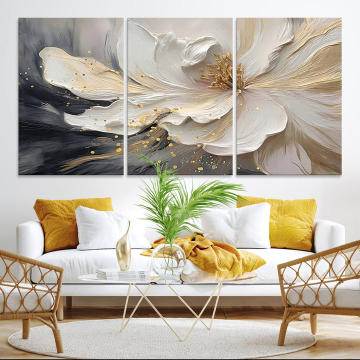 Elegant White and Gold Floral Triptych Canvas Art, a modern textured flower painting for home or office decor, features a blurred gray background.