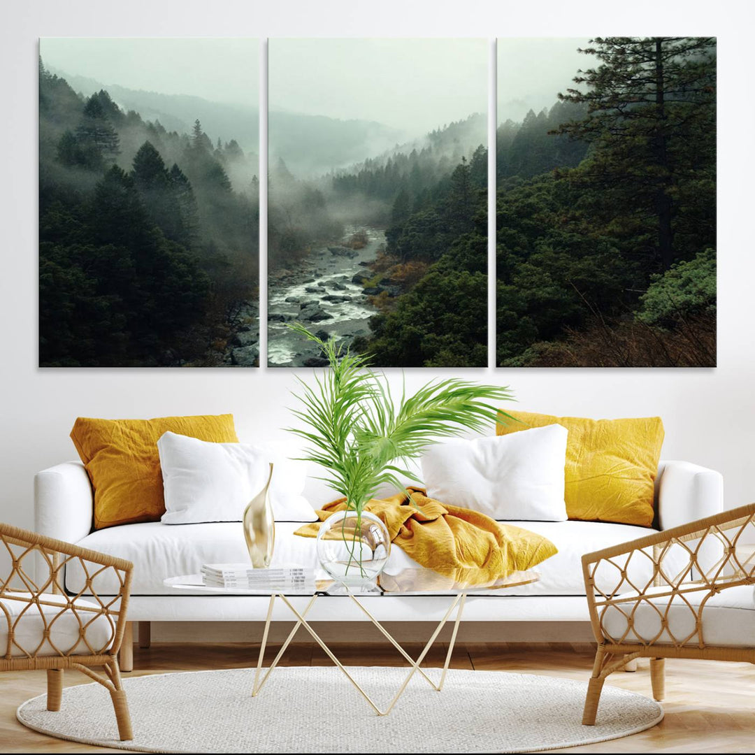 The Misty Forest Wall Art features a serene landscape with a misty river and evergreens, ideal for enhancing the ambiance of any living room or cabin.