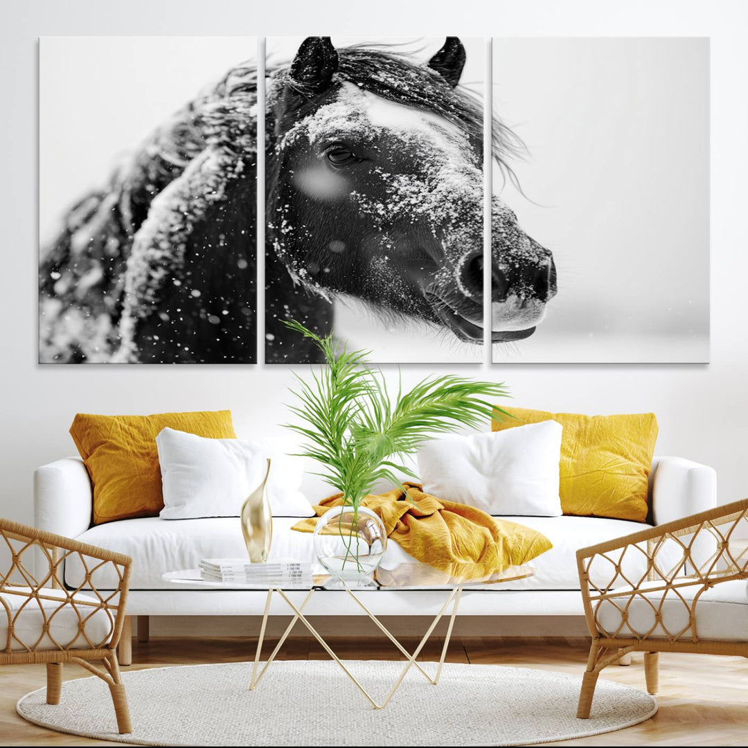 A large 3-panel rustic farmhouse wall art showcases a black and white winter horse canvas print against a snowy backdrop.