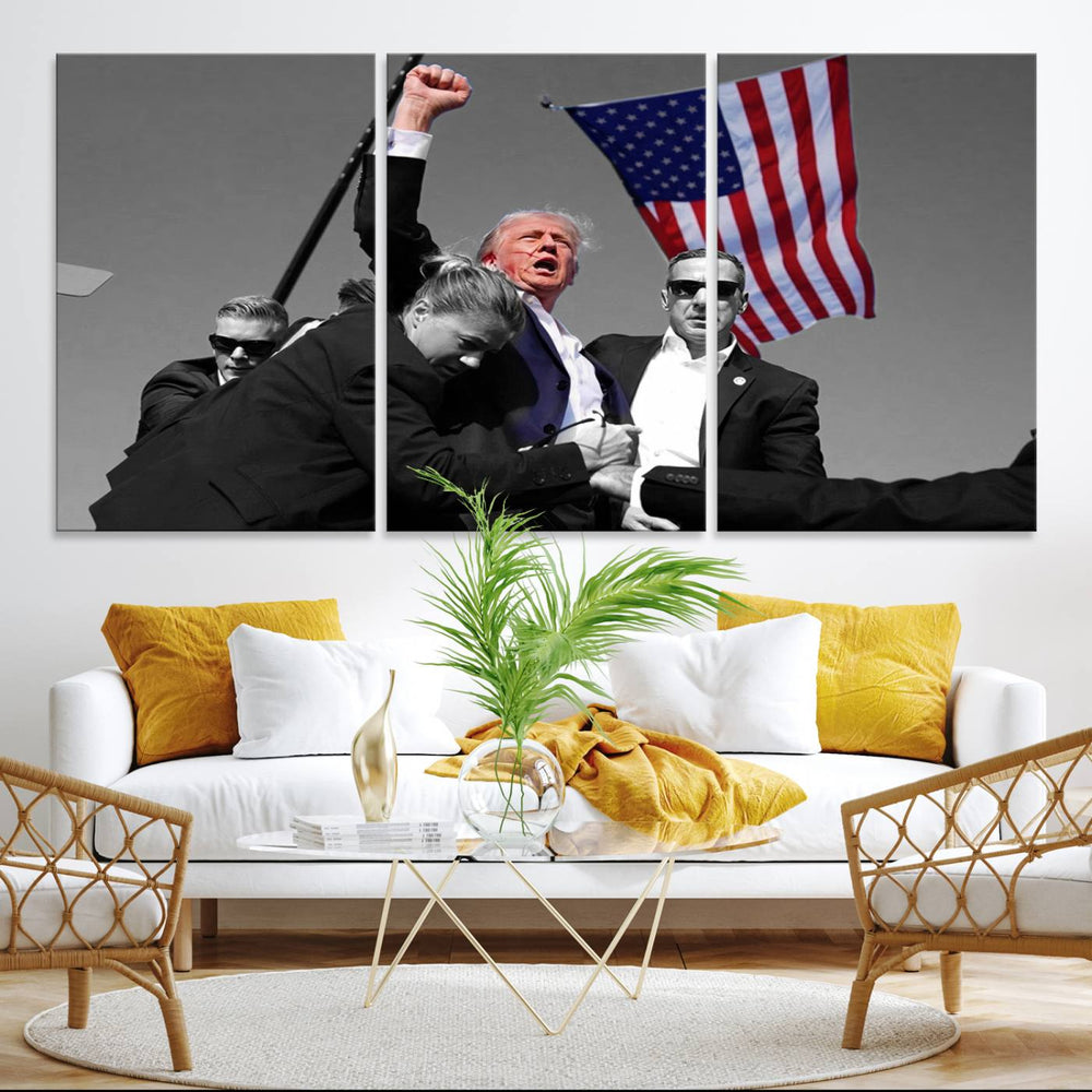 A wall art print depicts Donald Trump mid-speech, surrounded by guards and an American flag. This piece is titled Donald Trump Assassination Attempt Wall Art Print.